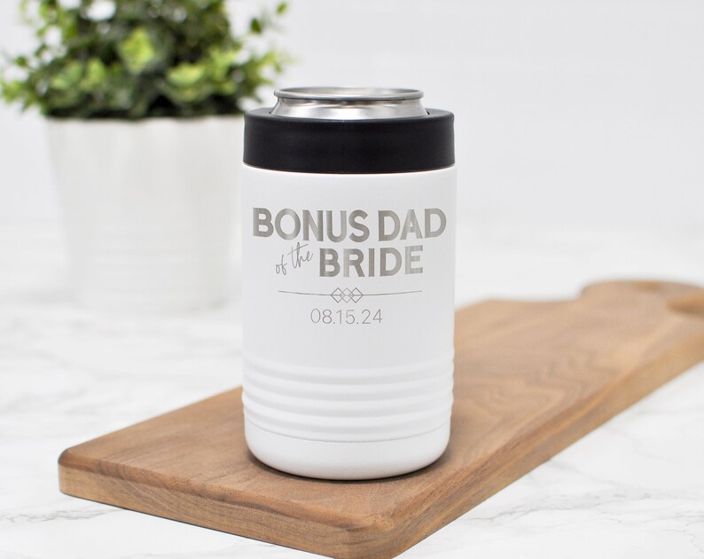 May include: White stainless steel can cooler with the text "Bonus Dad of the Bride" and the date "08.15.24" engraved on it.