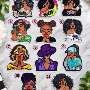 May include: Eleven embroidered patches featuring diverse Black women with various hairstyles, clothing, and religious text including Faith, Worship, Prayer, God First, Prayer Works, Trust God, Chasing God's World, and Saved, arranged in a numbered grid.