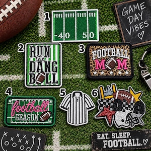 May include: Six embroidered patches featuring football themes: a green field with yard lines, a green and white striped patch with text, a leopard print patch with text, a green field patch with pink text, a referee shirt, and a multi-element patch.