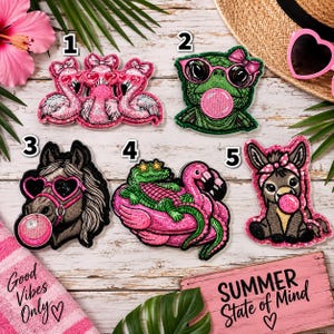 May include: Five embroidered patches featuring whimsical characters: three pink flamingos with heart-shaped glasses, a green turtle with pink glasses and bubblegum, a horse with heart glasses and bubblegum, a crocodile on a flamingo float, and a donkey with a pink headband and bubblegum.