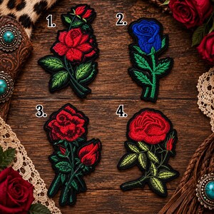 May include: Four embroidered rose patches labeled 1 through 4. Patch 1 shows a red rose with a bud and green leaves. Patch 2 features a blue rose with green leaves. Patch 3 displays a red rose with a bud. Patch 4 shows a red rose with a bud.
