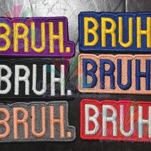 May include: A collection of embroidered patches, each featuring the word "BRUH." in a bold, stylized font. The patches come in various color combinations, including purple with yellow, blue with yellow, black with white, peach with blue, gray with peach, and red with white.