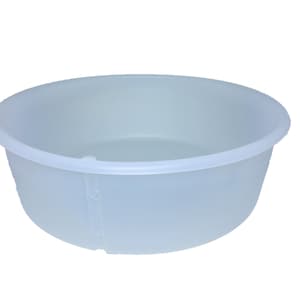 May include: A clear plastic basin, a large, round, shallow bowl with a smooth, slightly textured surface.