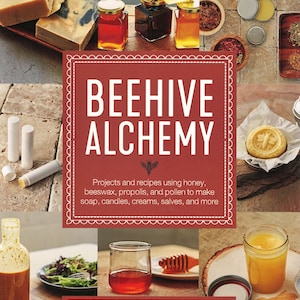 May include: A book cover with the title "Beehive Alchemy" in white text on a red background. The book features projects and recipes using honey, beeswax, propolis, and pollen to make soap, candles, creams, salves, and more. The author is Petra Ahnert, author of Beeswax Alchemy.