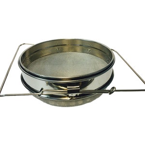 May include: A stainless steel honey strainer with a wire mesh filter and a handle. The strainer is designed to remove impurities from honey.