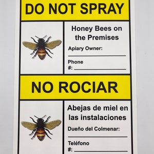 May include: A rectangular white sign with yellow sections at the top and bottom. The sign reads "DO NOT SPRAY" and "NO ROCIAR" with illustrations of bees. Text below the bee illustrations provides space for contact information.
