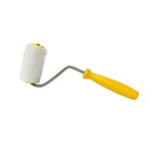 May include: A yellow-handled roller with a white, spiked roller head. The roller is used for pressing down on fabric or other materials.