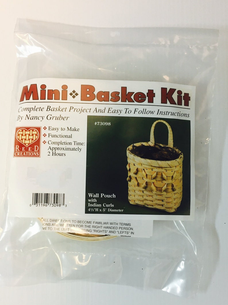 May include: A kit for making a small wall basket with Indian curls. The kit includes instructions and materials to create a 4 1/2 inch tall by 5 inch diameter basket. The kit is labeled "Mini Basket Kit" and is by Reed Creations.