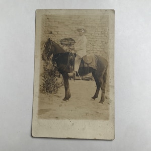 Man and horse. Vintage postcard.