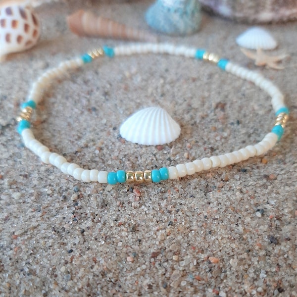 Cream, turquoise, and gold stackable stretch cord anklet bracelet.