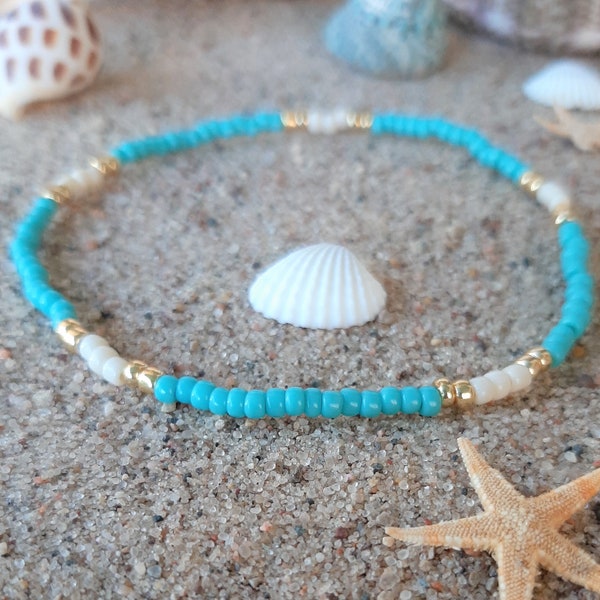 Minimalist turquoise, gold, and cream stackable stretch cord anklet bracelet.