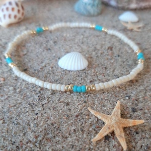 Cream, gold, and turquoise stackable stretch cord anklet bracelet.