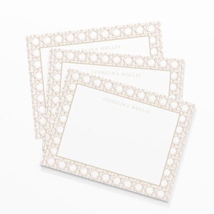 May include: A stack of three rectangular notecards with a light beige woven pattern border. The cards have a white interior with the name "GEORGINA HOLLIS" printed in a light beige font at the top.