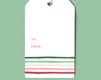 May include: White gift tag with a string, featuring the text "TO:" and "FROM:" in red. The bottom of the tag has horizontal stripes in green, pink, and red. The tag is against a green background.