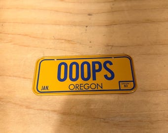 Oregon nieuwigheid fiets miniatuur kentekenplaat geel OOOPS vintage fiets 1980
