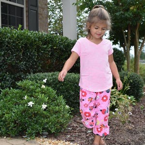 Pink ladybug pants for girls. Cute pants for girls with red and pink ladybugs. image 1