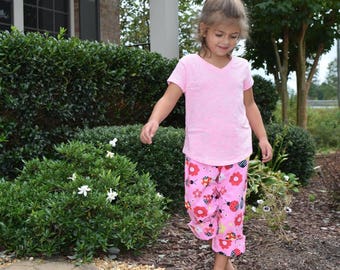 Roze lieveheersbeestje broek voor meisjes. Leuke broeken voor meisjes met rode en roze lieveheersbeestjes.