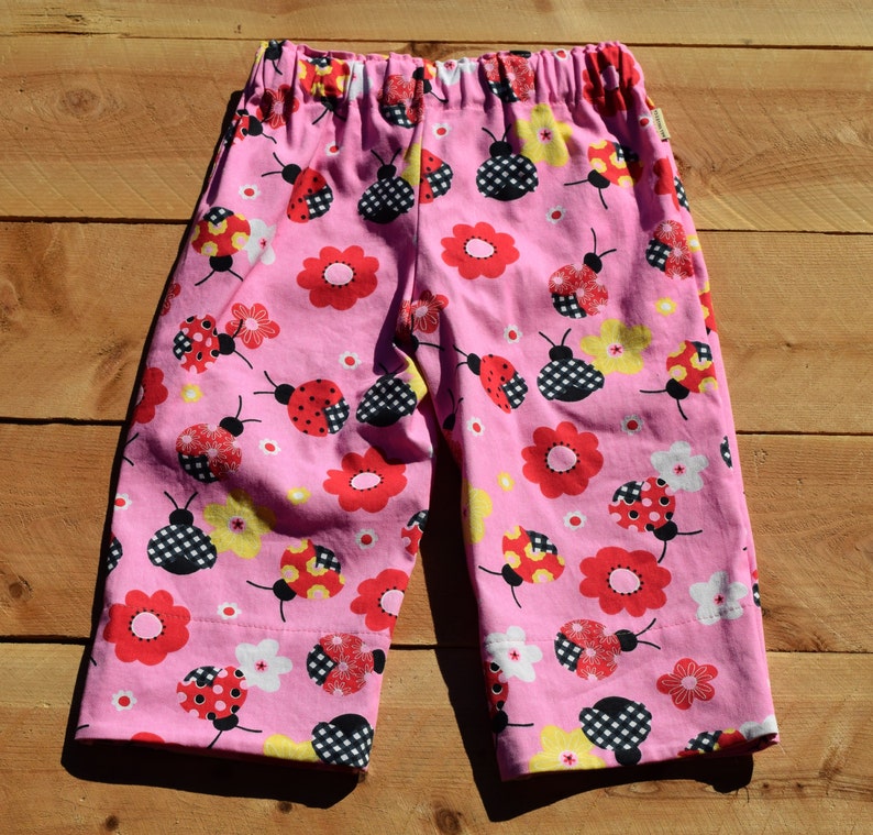 Pink ladybug pants for girls. Cute pants for girls with red and pink ladybugs. image 2