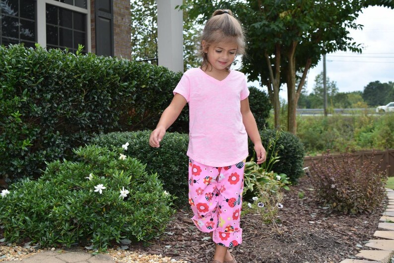 Pink ladybug pants for girls. Cute pants for girls with red and pink ladybugs. image 1