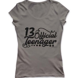 May include: Gray t-shirt with black text that reads "13 Official Teenager".