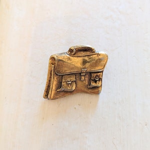 Broche doré cartable vintage