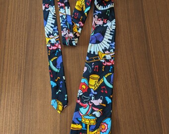 Beautiful vintage Disney Goofy Mickey Pluto tie. Black, purple, yellow 100% silk