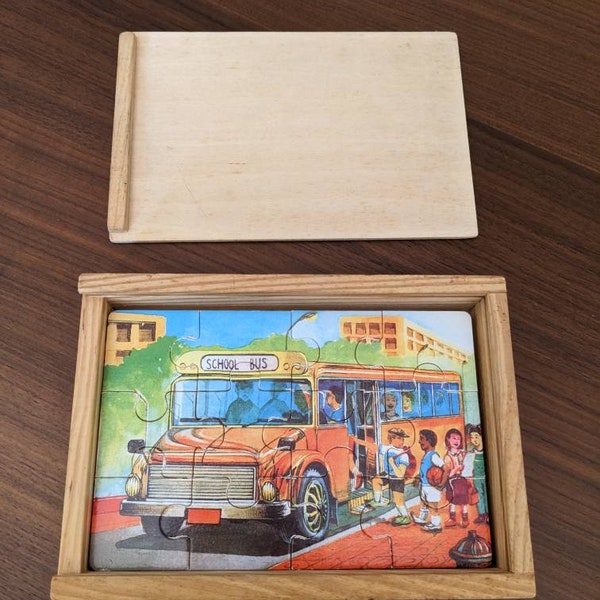 Box of x4 12-piece vintage wooden puzzles from the 1950s with a transport theme. Airplane, American school bus, train and fire truck. 2/3 years