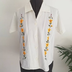 Vintage white blouse with floral pattern