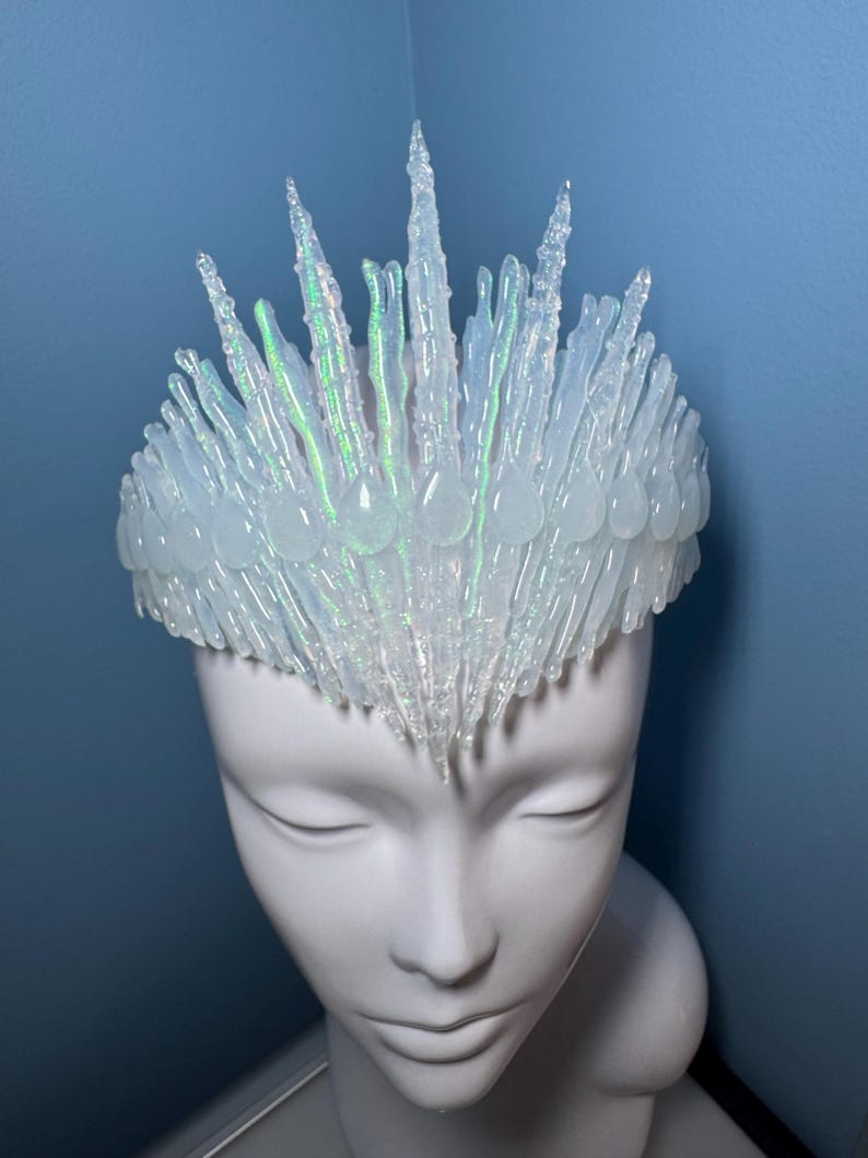 Iridescent Jewelled Ice Queen Crown.  A sculptured clear transparent real ice-like icicle crown with ice like ‘jewels’ and iridescence captured within each icicle and jewel.
