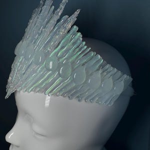 Iridescent Jewelled Ice Queen Crown.  A sculptured clear transparent real ice-like icicle crown with ice like ‘jewels’ and iridescence captured within each icicle and jewel.