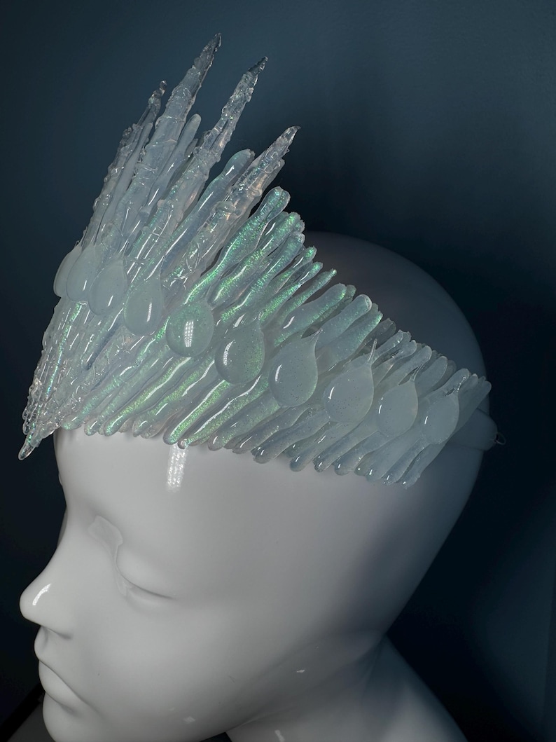 Iridescent Jewelled Ice Queen Crown.  A sculptured clear transparent real ice-like icicle crown with ice like ‘jewels’ and iridescence captured within each icicle and jewel.