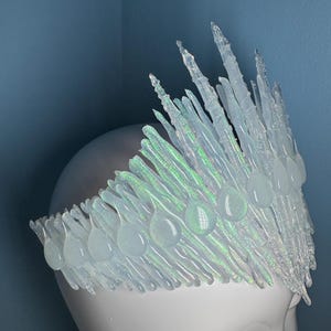 Iridescent Jewelled Ice Queen Crown.  A sculptured clear transparent real ice-like icicle crown with ice like ‘jewels’ and iridescence captured within each icicle and jewel.