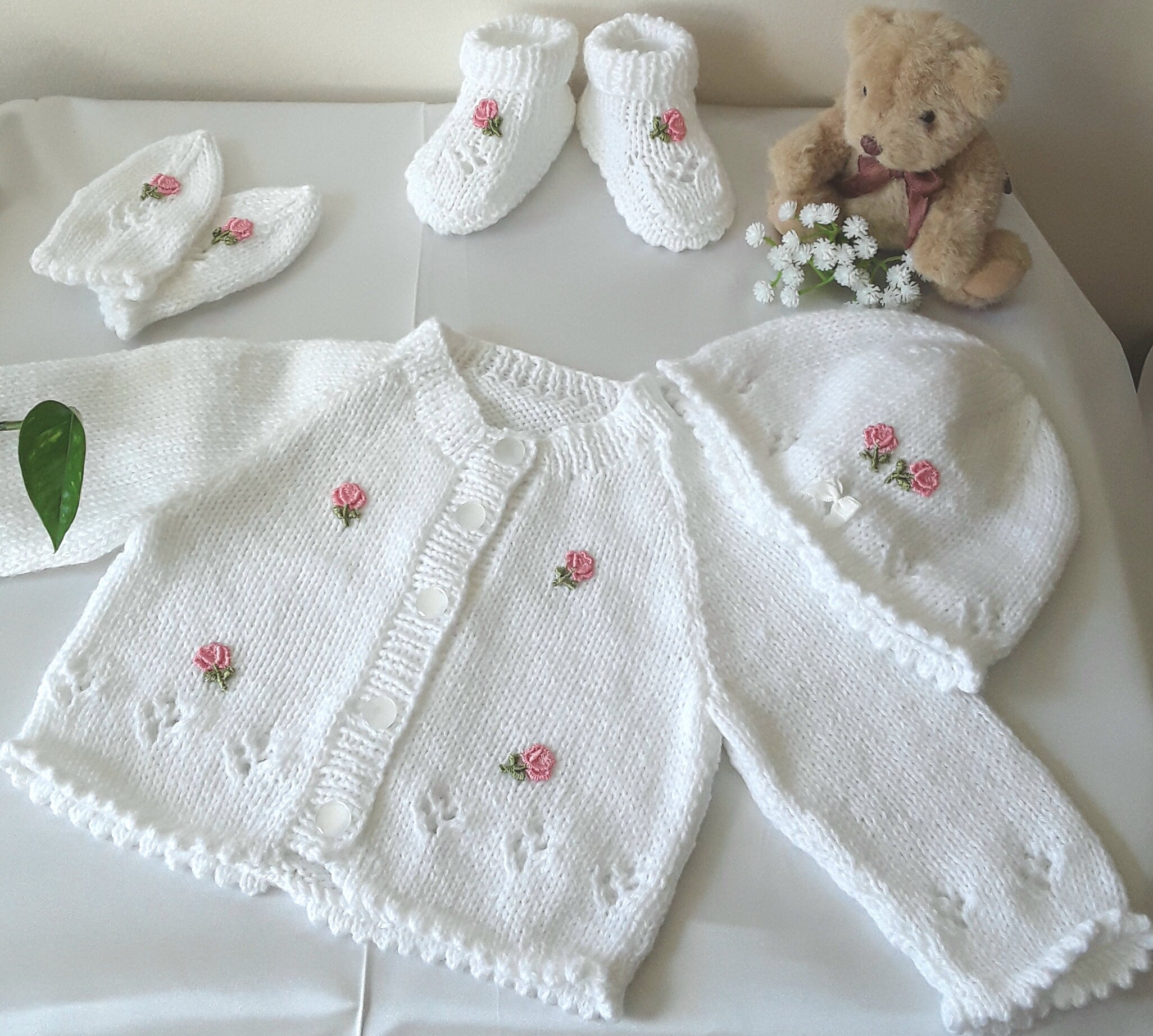 Hand knitted Newborn Baby Outfit with Embroidered Flowers.
