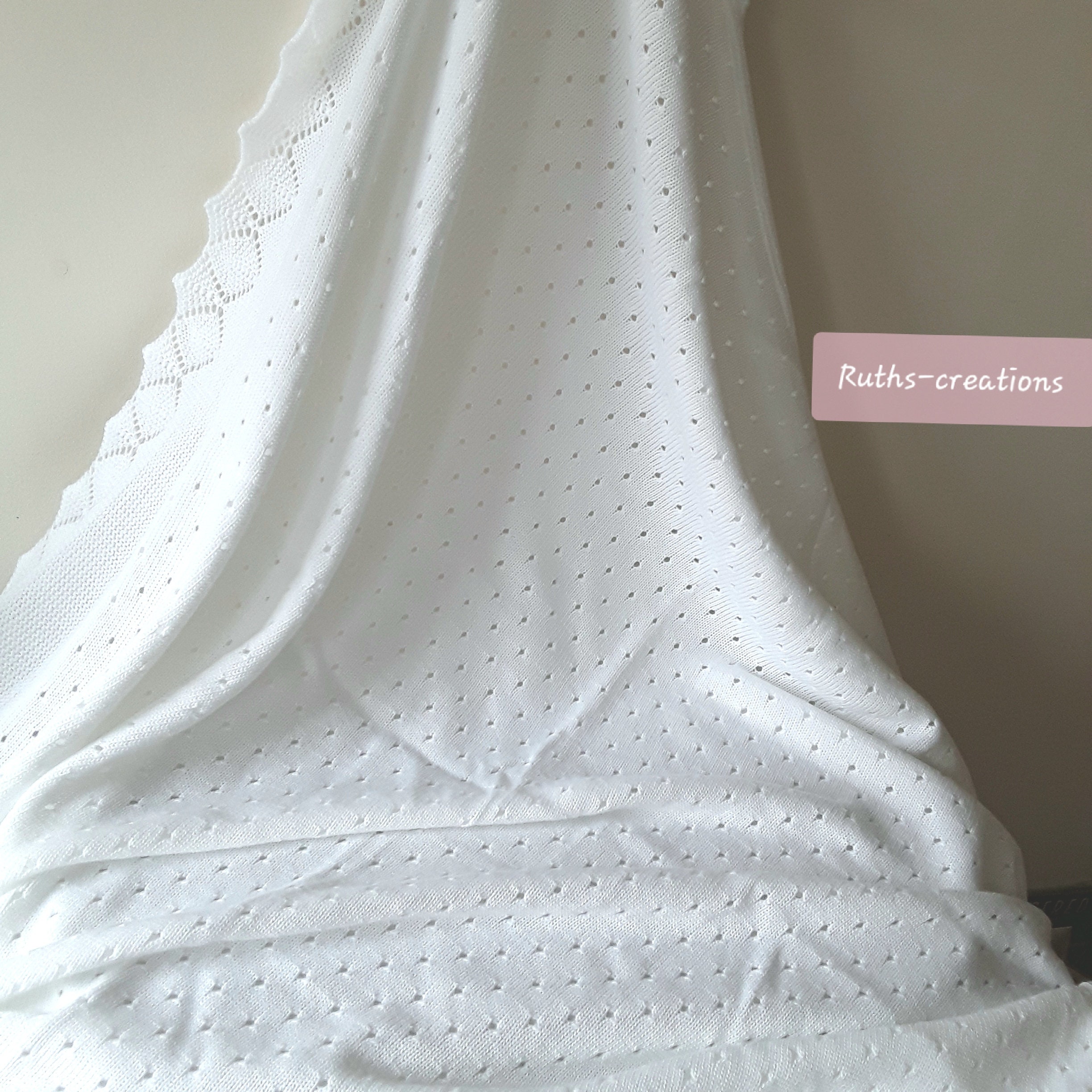 A Beautiful White Baby Shawl made with Acrylic.