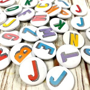 Alphabet pin badges. Word lover. Letter Button rainbow of colours. ''Bradford Buzz' font. Small 25mm, Large 38mm Name initial A-Z image 10