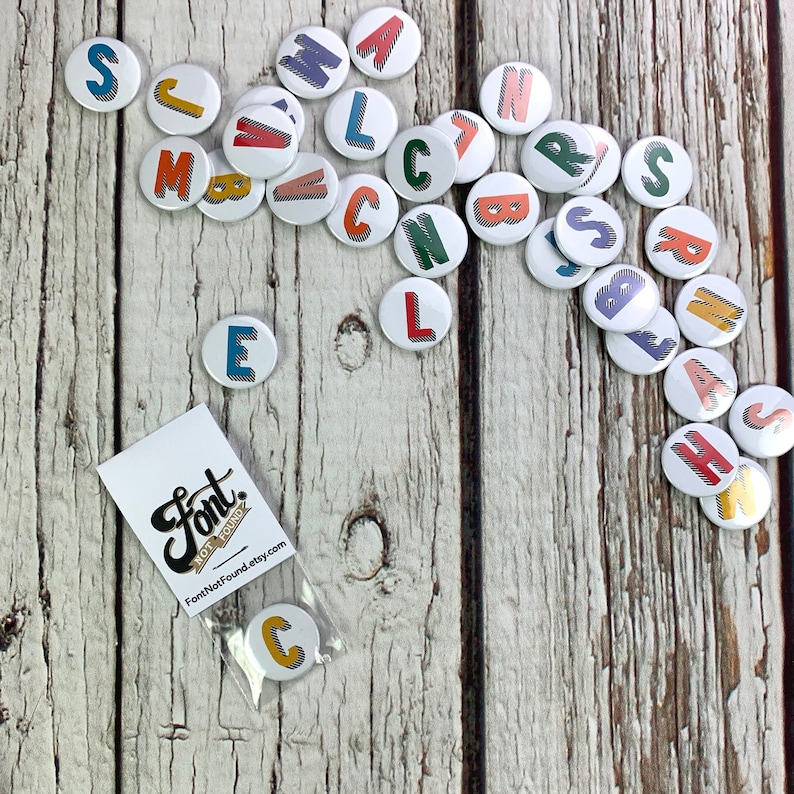 Alphabet pin badges. Word lover. Letter Button rainbow of colours. ''Bradford Buzz' font. Small 25mm, Large 38mm Name initial A-Z image 7