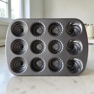 Nordic Ware Creme Filled Cupcake Muffin Baking Pan | Non-Stick Makes 6 Muffin Swirls