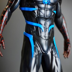 May include: A black and blue superhero costume with red accents. The suit features a detailed design with blue highlights and red web-like patterns on the arms. A blue emblem is on the chest.