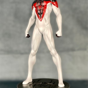 May include: A white and black Spider-Man action figure with red accents stands on a metallic base with a spider logo. The figure is posed in a heroic stance with arms outstretched.