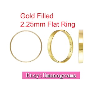 Peut inclure: Deux anneaux plats en or rempli, l'un de 2,25 mm de large et l'autre de 1,20 mm de large. Le plus grand anneau porte l'inscription "1/20 14K" à l'intérieur.