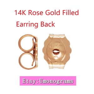 Peut inclure: Deux dos de boucles d'oreilles en or rose 14 carats. L'un est de style à poussoir standard et l'autre est un dos papillon.