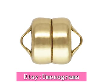 May include: Gold-toned magnetic clasp for jewelry making. The clasp is made of two round pieces with a small loop on each side. The pieces are magnetic and snap together.