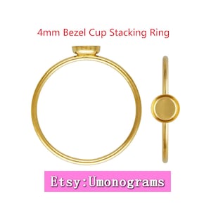 May include: Gold 4mm bezel cup stacking ring. The ring is shown from two angles. The ring is a simple band with a small cup on top. Etsy: Umonograms