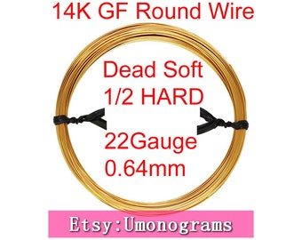 May include: A spool of 14K gold filled round wire, 22 gauge, 0.64mm in diameter. The wire is labeled "Dead Soft 1/2 HARD". The spool is wrapped in black tape. The text "Etsy: Umonograms" is visible at the bottom of the image.