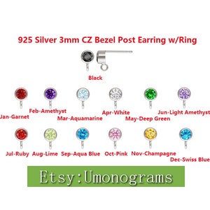 May include: A selection of 925 silver 3mm CZ bezel post earrings with a ring. The earrings are available in a variety of colors, including black, garnet, amethyst, aquamarine, white, green, ruby, lime, aqua blue, pink, champagne, and Swiss blue. The earrings are shown on a white background. Etsy: Umonograms