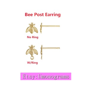 May include: Two gold bee post earrings, one with a jump ring and one without. The earrings are shown against a white background. The text "Bee Post Earring" is above the earrings. The text "No Ring" is below the earring without a jump ring. The text "W/Ring" is below the earring with a jump ring. The text "Etsy: Umonograms" is at the bottom of the image.