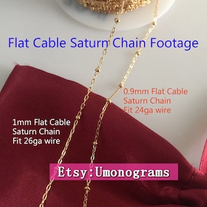 May include: Two gold flat cable Saturn chains on a red fabric background. The chain on the left is 1 mm wide and fits 26 gauge wire. The chain on the right is 0.9 mm wide and fits 24 gauge wire. The text "Etsy: Umonograms" is visible in the bottom right corner.