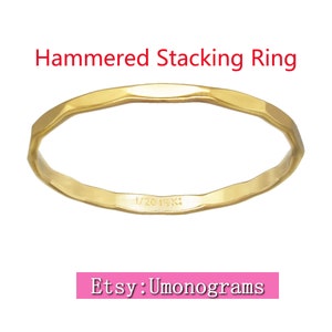 May include: A gold hammered stacking ring with a 1/20 14K stamp on the inside. The ring is simple and delicate, perfect for layering with other rings.