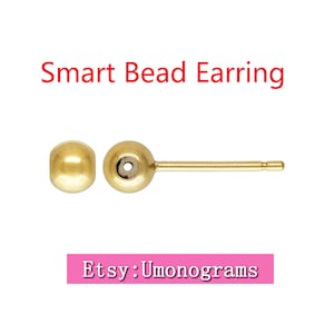 May include: Gold bead earring with a post and a small hole in the bead. The earring is on a white background. Etsy: Umonograms