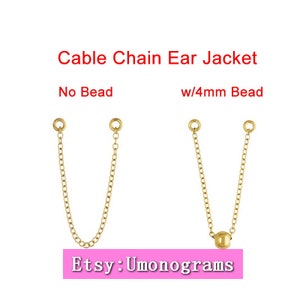 May include: Two gold cable chain ear jackets. The left jacket has no bead. The right jacket has a 4mm gold bead. The text "Cable Chain Ear Jacket" is above the jackets. The text "No Bead" is below the left jacket. The text "w/4mm Bead" is below the right jacket. The text "Etsy: Umonograms" is below the jackets.
